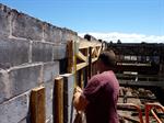 A worker takes a measurement while installing the new roof. - , Utah