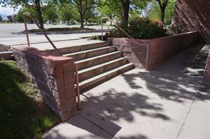 Stairs down from the front sidewalk to the auditorium exits. - , Utah
