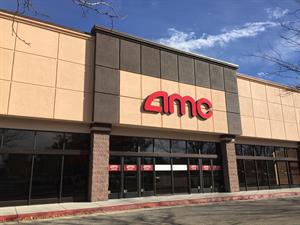 The entrance of the AMC West Jordan 12, with the new theater chain's logo above the doors in red letters. - , Utah