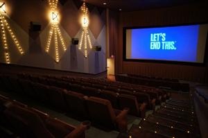 The words 'Let's End This' happen to appear in pre-showtime video while a photo is snapped on the last day the theater was open for business. - , Utah