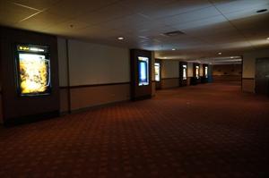 Poster cases line the walls of the exit hall, looking toward the main hall. - , Utah