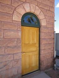 A door at the north end of the east wall. - , Utah
