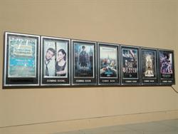 Poster cases along the west wall of the theater. - , Utah