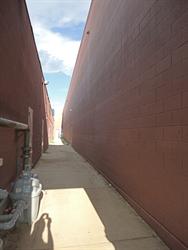 An alley between the theater on the right, and retail space on the left. Auditoriums on the north side exit into this alley. - , Utah