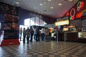 A line of moviegoers wait at the concessions stand. - , Utah