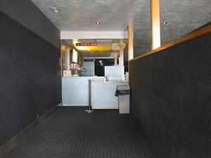 A partition wall on the right separates entrance traffic from the exit.  Ahead is the side of the concessions stand.  After purchasing tickets, moviegoers move to the right, past the partition. - , Utah