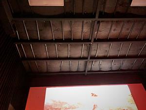 Looking up at the ceiling of Theater 3, where insulation fills the space between joists. - , Utah