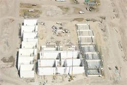 Aerial view of construction.  The walls of 11 theaters are up.  The theaters form a U shape.