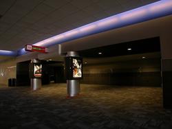 The entrance to Theater 11 has two poster cases, an electronic display, and a large waiting area. - , Utah