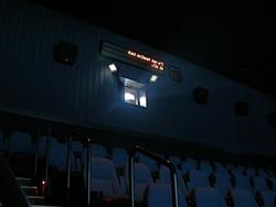 Text displays backwards above the projection window of Theater 3.
