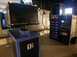 A digital projector with the number 12 on it, with Dolby Digital Cinema equipment in the background. - , Utah