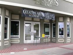 Above the entrance hangs a banner for the Creative Arts Academy. - , Utah