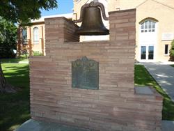 A bell and historical marker along Main Street. - , Utah