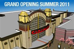 A rendering of the entrance of the Cinemark at Station Park, with retail buildings along the sides.
