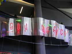 The words 'Box Office' appear in neon above the ticket counter. - , Utah
