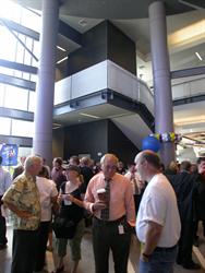 A crowd gathers in the lobby.  In the background is the stairway leading up to the second level. - , Utah