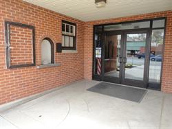 The left side of the entrance has a poster case, ticket window, and RCA plaque. - , Utah