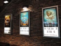 Three movie poster cases on the stairway wall. - , Utah