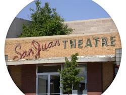 The neon letters of theater's name appear to touch the top of an awning added to the theater's entrance. - , Utah