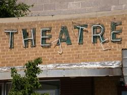 Damaged neon hangs from the word "theatre" over the entrance. - , Utah