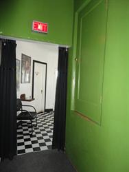 A short doorway on one side of the projection booth.  The main entrance to the booth is from the other aisle. - , Utah