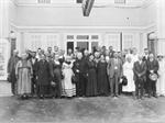 A group of men and women stand in front of the two sets of double entrance doors. - , Utah