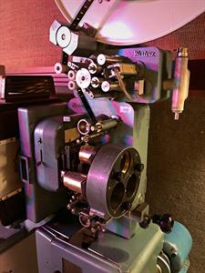 35mm film threaded through the sound head and projection gate of a Westrex projector. - , Utah