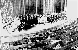 Church, educational, and civic leaders sit on the right side of the stage at the dedicatory exercises of the Pioneer Memorial Theatre.  On the left is the University of Utah A Cappella Choir. - , Utah