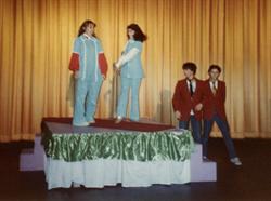 Laurie Hansen and Jan Oram model blue polyester uniforms from 1977 at the December 1983 Christmas party. - , Utah