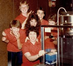 Laughing employees pose for a photo behind the snack bar. - , Utah