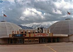 The entrance and marquee of the Cinedome 70 with part of both domes on the sides and clouds in the sky. - , Utah