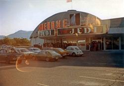 Moviegoers line up below the marquee with the double 'Jedi' sign.  The north dome is in the background. - , Utah