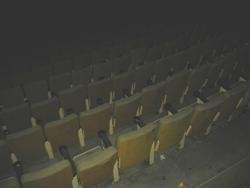 Several rows of grungy, yellow seats descend into darkness. - , Utah