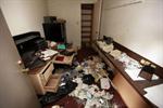 Items clutter the floor in the smaller of the two office rooms. - , Utah