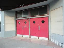 Poster cases on either side of the entrance doors are boarded over. - , Utah