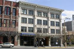 The southern building has a white facade and four stories. - , Utah