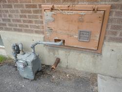 A natural gas meter enters the building through the old coal chute. - , Utah