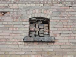 Bricks stacked loosely in a window along the north wall. - , Utah