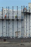 Construction workers atop scaffolding around the walls of the theater. - , Utah