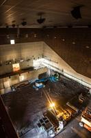 The unfinished Dolby Atmos auditorium, with surround speakers mounted on the ceiling even before the seating risers have been installed. - , Utah