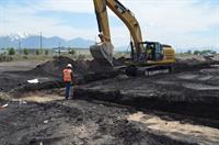 A backhoe diggs the footings for the theater walls. - , Utah
