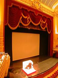 The stage of the Capitol Theatre with the movie screen and Wurlitzer organ console in place. - , Utah