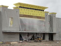 A large sheet of plastic covers the entrance of the theater as work begins on finished the exterior walls. - , Utah