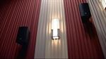 Surround speakers and a light fixture on an auditorium wall. - , Utah