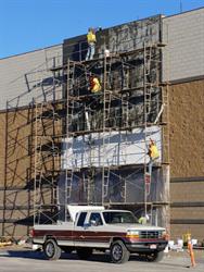<p>Workers apply stucco to a section of the south exterior wall.</p> - , Utah
