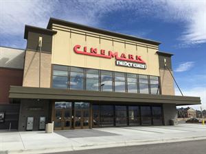 The entrance features a Cinemark NextGen sign, with two sets of double doors on the left.