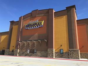 The Larry H. Miller Megaplex Theatres sign in the center of the south exterior wall. - , Utah