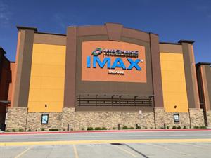 The Washakie Renewable Energy appears above the IMAX Theatre logo on the east wall of the theater. - , Utah