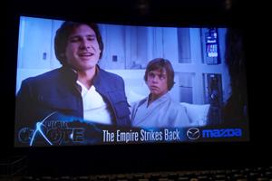 A scene from <em>The Empire Strikes Back</em> plays on the screen in Theater 4 during the preshow. - , Utah
