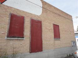 Boarded up windows and a door in the north exterior wall. - , Utah